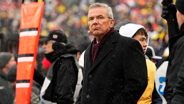Former head coach Urban Meyer watches from the sideline during the NCAA football game between the Michigan Wolverines and the Ohio State Buckeyes. Former head coach Urban Meyer watches from the sideline during the NCAA football game between the Michigan Wolverines and the Ohio State Buckeyes.