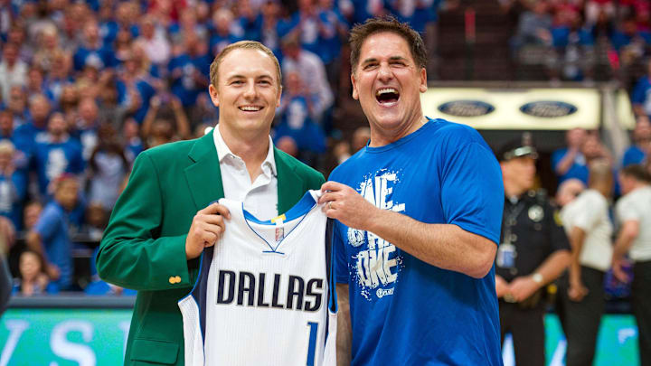 Apr 26, 2015; Dallas, TX, USA; Dallas Mavericks owner Mark Cuban presents a team jersey to Masters champion Jordan Spieth during the second quarter of the game between the Mavericks and the Houston Rockets in game four of the first round of the NBA Playoffs. at American Airlines Center. Mandatory Credit: Jerome Miron-Imagn Images Apr 26, 2015; Dallas, TX, USA; Dallas Mavericks owner Mark Cuban presents a team jersey to Masters champion Jordan Spieth during the second quarter of the game between the Mavericks and the Houston Rockets in game four of the first round of the NBA Playoffs. at American Airlines Center. Mandatory Credit: Jerome Miron-Imagn Images