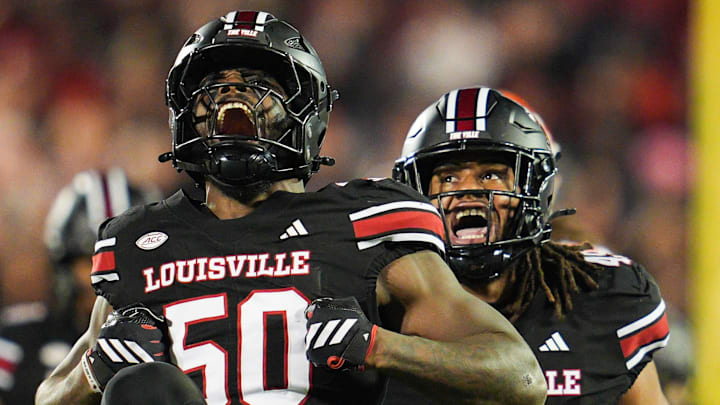 Louisville Cardinals defensive lineman Clev Lubin (50) celebrates his tackle of Clemson Tigers quarterback Cade Klubnik (2) in the first half at L&N Stadium Friday, Nov. 14, 2025.