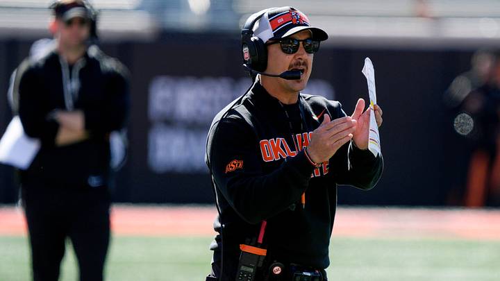 Oklahoma State coach Eric Morris calls a time out during a spring football game. Oklahoma State coach Eric Morris calls a time out during a spring football game.
