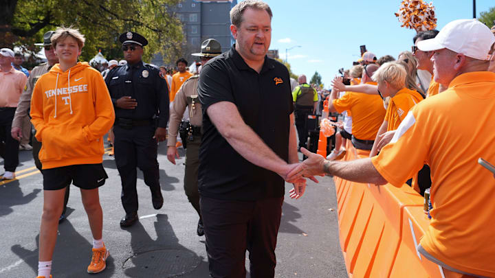 Tennessee coach Josh Heupel greets fans along the Vol Walk for the NCAA college football game against Arkansas on Oct. 11, 2025, in Knoxville, Tennessee. Tennessee coach Josh Heupel greets fans along the Vol Walk for the NCAA college football game against Arkansas on Oct. 11, 2025, in Knoxville, Tennessee.