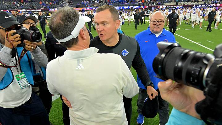 Washington head coach Jedd Fisch and Boise State's Spencer Danielson shake hands after the LA Bowl. Washington head coach Jedd Fisch and Boise State's Spencer Danielson shake hands after the LA Bowl.