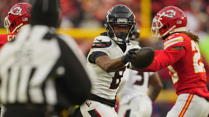 Jan 18, 2025; Kansas City, Missouri, USA; Houston Texans wide receiver John Metchie III (8) reacts after catching a pass against the Kansas City Chiefs during the third quarter of a 2025 AFC divisional round game at GEHA Field at Arrowhead Stadium. Mandatory Credit: Jay Biggerstaff-Imagn Images