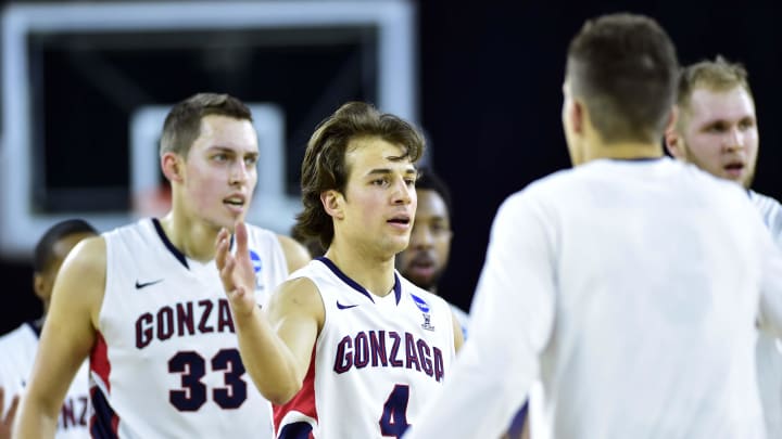 Mar 27, 2015; Houston, TX, USA; Gonzaga Bulldogs guard Kevin Pangos (4) and forward Kyle Wiltjer (33) celebrate as they head to the bench for a timeout against the UCLA Bruins during the second half in the semifinals of the south regional of the 2015 NCAA Tournament at Reliant Stadium. Mandatory Credit: Bob Donnan-USA TODAY Sports