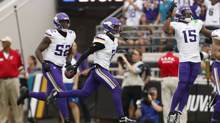 Nov 10, 2024; Jacksonville, Florida, USA; Minnesota Vikings cornerback Byron Murphy (7), offensive linebacker Jihad Ward (52), and offensive linebacker Dallas Tucker (15) celebrate an interception against the Jacksonville Jaguars during the fourth quarter at EverBank Stadium.