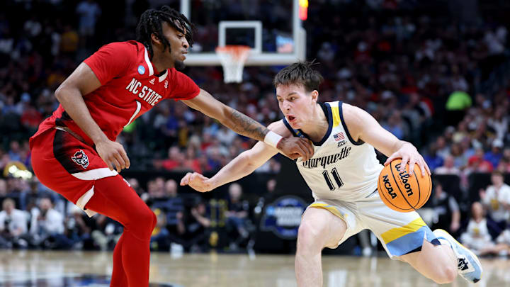 Mar 29, 2024; Dallas, TX, USA; Marquette Golden Eagles guard Tyler Kolek (11) drives against North Carolina State Wolfpack guard Jayden Taylor (1) during the first half in the semifinals of the South Regional of the 2024 NCAA Tournament at American Airlines Center. Mandatory Credit: Kevin Jairaj-Imagn Images Mar 29, 2024; Dallas, TX, USA; Marquette Golden Eagles guard Tyler Kolek (11) drives against North Carolina State Wolfpack guard Jayden Taylor (1) during the first half in the semifinals of the South Regional of the 2024 NCAA Tournament at American Airlines Center. Mandatory Credit: Kevin Jairaj-Imagn Images