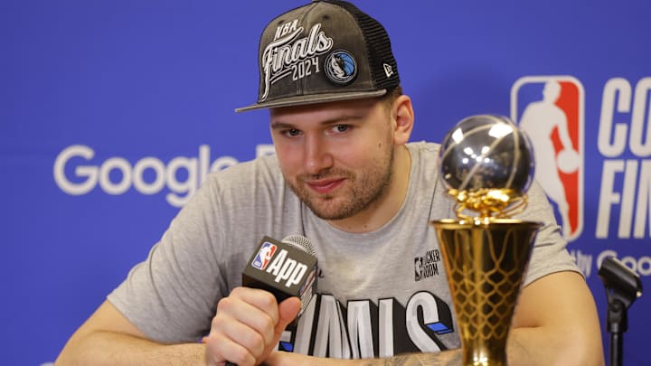 May 30, 2024; Minneapolis, Minnesota, USA; Dallas Mavericks guard Luka Doncic (77) at a press conference after winning the Western Conference Championship against the Minnesota Timberwolves in game five of the western conference finals for the 2024 NBA playoffs at Target Center. Mandatory Credit: Bruce Kluckhohn-Imagn Images