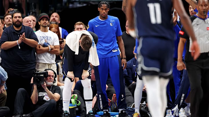 Jun 12, 2024; Dallas, Texas, USA; Dallas Mavericks guard Luka Doncic (77) reacts on the bench during the fourth quarter during game three of the 2024 NBA Finals against the Boston Celtics at American Airlines Center. Mandatory Credit: Kevin Jairaj-USA TODAY Sports Jun 12, 2024; Dallas, Texas, USA; Dallas Mavericks guard Luka Doncic (77) reacts on the bench during the fourth quarter during game three of the 2024 NBA Finals against the Boston Celtics at American Airlines Center. Mandatory Credit: Kevin Jairaj-USA TODAY Sports