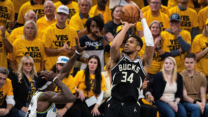 Apr 29, 2025; Indianapolis, Indiana, USA; Milwaukee Bucks forward Giannis Antetokounmpo (34) shoots the ball while  Indiana Pacers forward Pascal Siakam (43) defends during game five of the first round for the 2024 NBA Playoffs at Gainbridge Fieldhouse. Mandatory Credit: Trevor Ruszkowski-Imagn Images