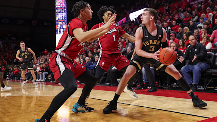 Purdue guard Braden Smith (3) looks to pass as Rutgers guard Jamichael Davis (1) and guard Derek Simpson (0) defend 