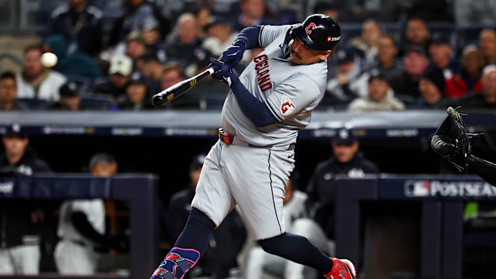 Oct 15, 2024; Bronx, New York, USA; Cleveland Guardians first base Josh Naylor (22) hits a single during the second inning against the New York Yankees in game two of the ALCS for the 2024 MLB Playoffs at Yankee Stadium.