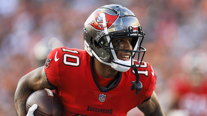 Aug 10, 2024; Cincinnati, Ohio, USA; Tampa Bay Buccaneers wide receiver Trey Palmer (10) runs with the ball against the Cincinnati Bengals in the first half at Paycor Stadium. Mandatory Credit: Katie Stratman-Imagn Images
