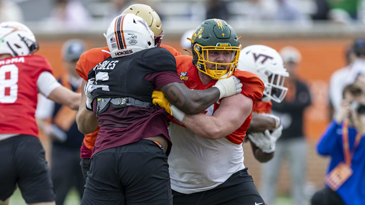 National team defensive lineman Aeneas Peebles of Virginia Tech battles offensive lineman Grey Zabel of North Dakota State.