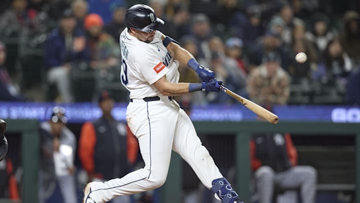 Seattle Mariners catcher Cal Raleigh hits a home run during a game against the Detroit Tigers on March 31 at T-Mobile Park. Seattle Mariners catcher Cal Raleigh hits a home run during a game against the Detroit Tigers on March 31 at T-Mobile Park.