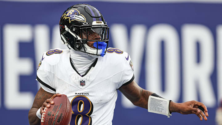 Baltimore Ravens quarterback Lamar Jackson looks to throw a pass.