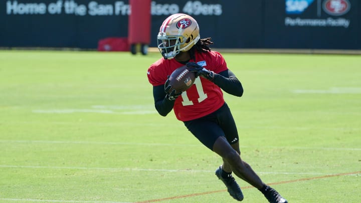 Jul 27, 2023; Santa Clara, CA, USA; San Francisco 49ers wide receiver Brandon Aiyuk (11) runs with the ball after a catch during training camp at the SAP Performance Facility. Mandatory Credit: Robert Edwards-USA TODAY Sports