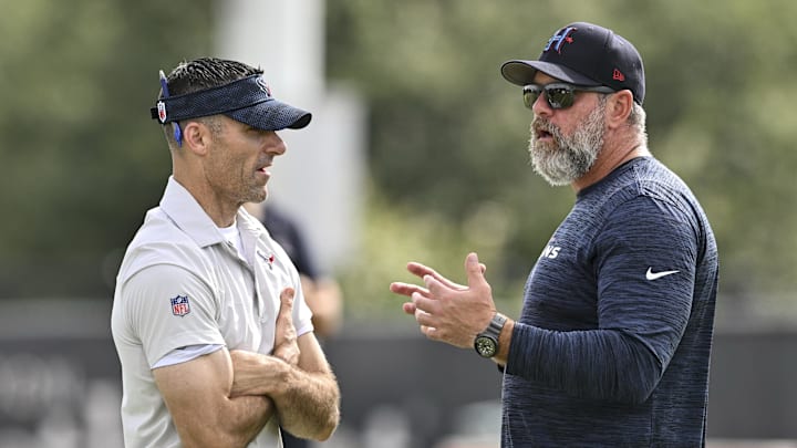 Jun 10, 2025; Houston, TX, USA; Houston Texans executive vice president and general manager Nick Caserio, left, speaks with defensive coordinator Matt Burke, right, during an NFL football minicamp at NRG Stadium. Mandatory Credit: Maria Lysaker-Imagn Images 