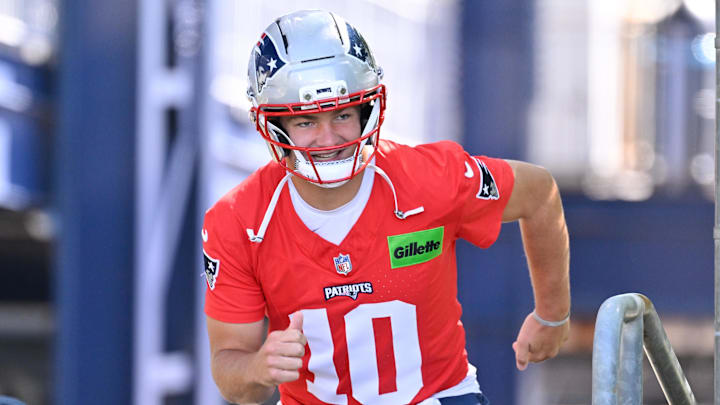 Jul 23, 2025; Foxborough, MA, USA; New England Patriots quarterback Drake Maye (10) runs out to the practice fields for day one of training camp at Gillette Stadium. Mandatory Credit: Eric Canha-Imagn Images