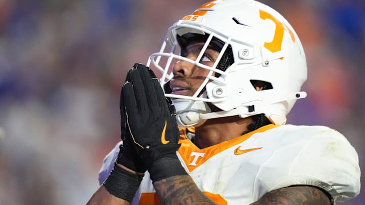 Tennessee running back DeSean Bishop (18) puts his hands together in celebration after scoring a touchdown in an NCAA college football game against Florida on November 22, 2025, in Gainesville, Florida.
