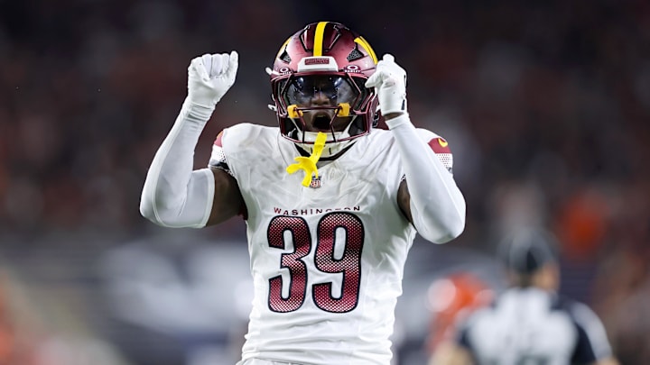 Sep 23, 2024; Cincinnati, Ohio, USA; Washington Commanders safety Jeremy Reaves (39) celebrates his tackle during the first quarter against the Cincinnati Bengals at Paycor Stadium. Mandatory Credit: Joseph Maiorana-Imagn Images