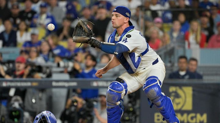 Oct 1, 2025; Los Angeles, California, USA; Los Angeles Dodgers catcher Ben Rortvedt (47) fields a throw to make an out at home plate against the Cincinnati Reds in the sixth inning during game two of the Wildcard round for the 2025 MLB playoffs at Dodger Stadium. Mandatory Credit: Jayne Kamin-Oncea-Imagn Images