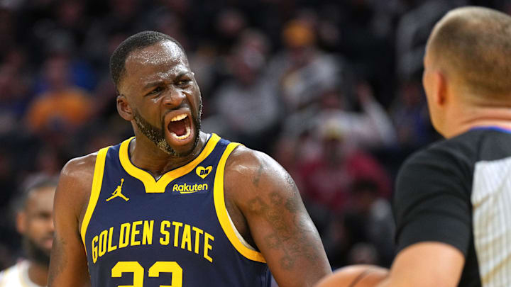 Jan 27, 2024; San Francisco, California, USA; Golden State Warriors forward Draymond Green (23) yells at referee John Goble (right) during the fourth quarter against the Los Angeles Lakers at Chase Center. Mandatory Credit: Darren Yamashita-Imagn Images