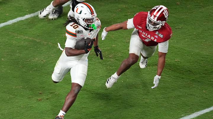 Jan 19, 2026; Miami Gardens, FL, USA; Miami Hurricanes wide receiver Malachi Toney (10) runs with the ball for a touchdown against the Indiana Hoosiers during the second half of the College Football Playoff National Championship game at Hard Rock Stadium. Mandatory Credit: James Lang-Imagn Images