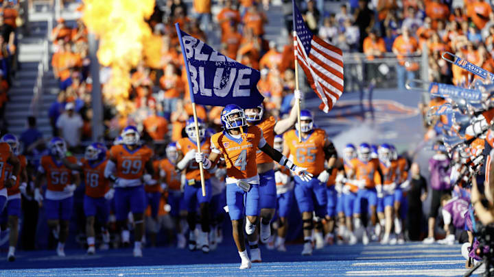 Boise State Broncos safety Rodney Robinson (4) leads the team onto the field before a game against the Utah State Aggies.