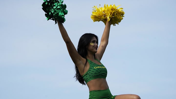 Sep 13, 2025; Evanston, Illinois, USA; A Oregon Ducks cheerleader during the second half of a game against the Northwestern Wildcats at Northwestern Medicine Field at Martin Stadium. Mandatory Credit: David Banks-Imagn Images