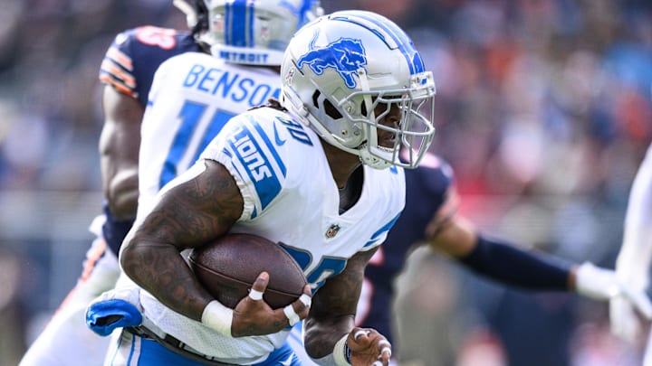 Nov 13, 2022; Chicago, Illinois, USA; Detroit Lions running back Jamaal Williams (30) runs the ball in the first quarter against the Chicago Bears at Soldier Field.
