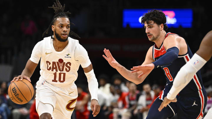 Feb 7, 2024; Washington, District of Columbia, USA; Cleveland Cavaliers guard Darius Garland (10) dribbles as Washington Wizards forward Deni Avdija (8) defends during the first half at Capital One Arena. Mandatory Credit: Brad Mills-USA TODAY Sports
