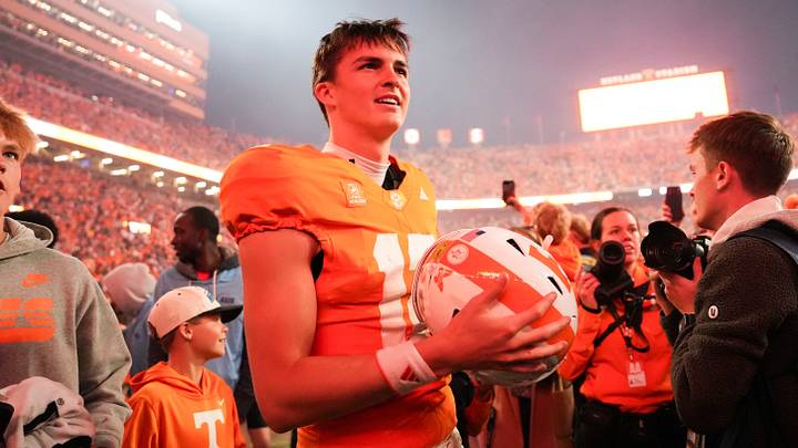 Cigar smoke floats in the air as Tennessee quarterback George MacIntyre (12) celebrates after a game between Tennessee and Alabama in Neyland Stadium in Knoxville, Tenn., Oct. 17, 2026.