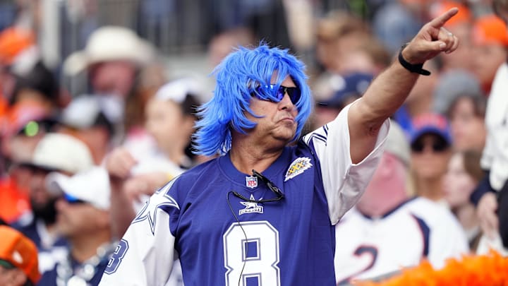 A Dallas Cowboys fan reacts in the first half against the Denver Broncos at Empower Field at Mile High.