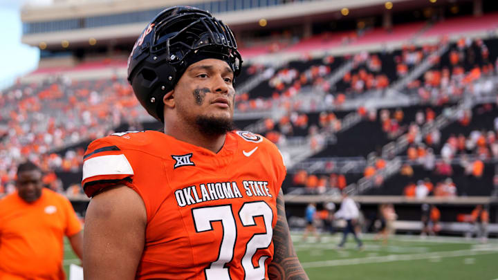 Oklahoma State's Isaia Glass (72) walks of the field following the college football between the Oklahoma State University Cowboys and the Utah Utes at Boone Pickens Stadium in Stillwater, Okla., Saturday, Sept., 21, 2024.