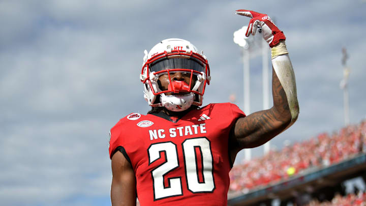 Nov 2, 2024; Raleigh, North Carolina, USA; North Carolina State Wolfpack running back Hollywood Smothers (20) celebrates a touchdown in the second half against the Stanford Cardinals at Carter-Finley Stadium. Mandatory Credit: Zachary Taft-Imagn Images Nov 2, 2024; Raleigh, North Carolina, USA; North Carolina State Wolfpack running back Hollywood Smothers (20) celebrates a touchdown in the second half against the Stanford Cardinals at Carter-Finley Stadium. Mandatory Credit: Zachary Taft-Imagn Images
