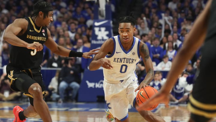 Kentucky's guard Rob Dillingham (0) drives past Vanderbilt's guard Ezra Manjon (5) during the first half of an NCAA basketball game at Rupp Arena in Lexington, Ky., Wednesday, Mar. 6, 2024