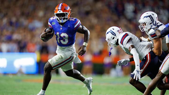 Sep 5, 2026; Gainesville, Florida, USA;  Florida Gators running back Jadan Baugh (13) runs with the ball against the Florida Atlantic Owls during the first half at Ben Hill Griffin Stadium.  Mandatory Credit: Matt Pendleton-Imagn Images