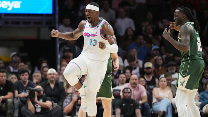 Apr 5, 2025; Miami, Florida, USA;  Miami Heat center Bam Adebayo (13) celebrates a shot made over Milwaukee Bucks forward Taurean Prince (12) during the second half at Kaseya Center. Mandatory Credit: Jim Rassol-Imagn Images