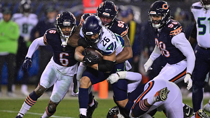 Seattle's Zach Charbonnet attempts to elude tacklers in one of the better games turned in this season by the Bears defense. Seattle's Zach Charbonnet attempts to elude tacklers in one of the better games turned in this season by the Bears defense.
