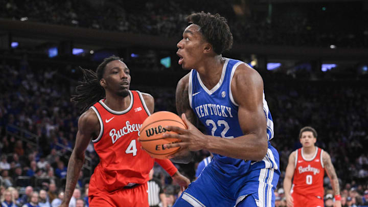 Dec 21, 2024; New York, New York, USA; Kentucky Wildcats center Amari Williams (22) looks to shoot the ball as Ohio State Buckeyes forward Aaron Bradshaw (4) defends during the first half at Madison Square Garden. Mandatory Credit: John Jones-Imagn Images