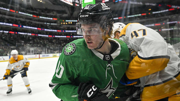 Dec 12, 2024; Dallas, Texas, USA; Dallas Stars center Oskar Back (10) and Nashville Predators right wing Michael McCarron (47) in action during the game between the Dallas Stars and the Nashville Predators at American Airlines Center. Mandatory Credit: Jerome Miron-Imagn Images