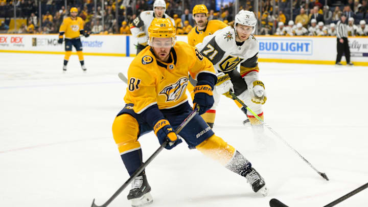 Jan 14, 2025; Nashville, Tennessee, USA;  Nashville Predators center Jonathan Marchessault (81) skates with the puck against the Vegas Golden Knights during the first period at Bridgestone Arena. Mandatory Credit: Steve Roberts-Imagn Images