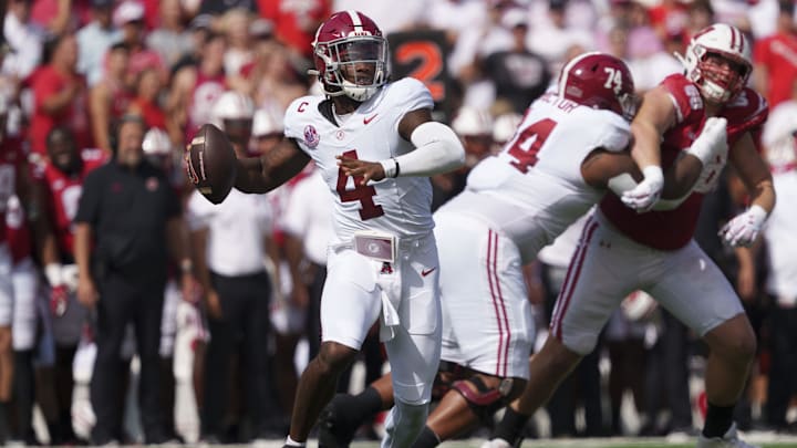 Sep 14, 2024; Madison, Wisconsin, USA;  Alabama Crimson Tide quarterback Jalen Milroe (4) throws a pass during the first quarter against the Wisconsin Badgers at Camp Randall Stadium. Mandatory Credit: Jeff Hanisch-Imagn Images