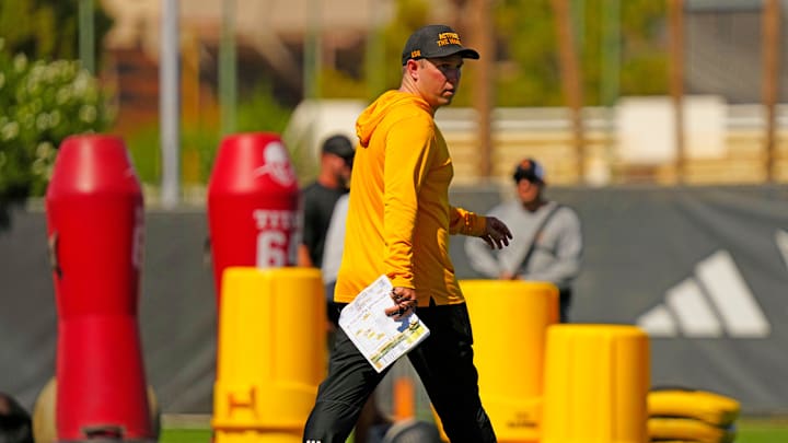 Arizona State head coach Kenny Dillingham watches his squad during the first day of fall practice in Tempe, Ariz. on July 30, 2025. Arizona State head coach Kenny Dillingham watches his squad during the first day of fall practice in Tempe, Ariz. on July 30, 2025.