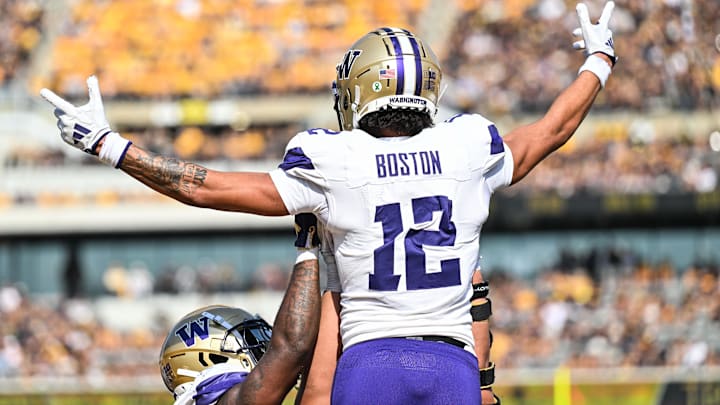 Oct 12, 2024; Iowa City, Iowa, USA; Washington Huskies wide receiver Denzel Boston (12) reacts after catching a touchdown pass during the second quarter against the Iowa Hawkeyes at Kinnick Stadium. Mandatory Credit: Jeffrey Becker-Imagn Images