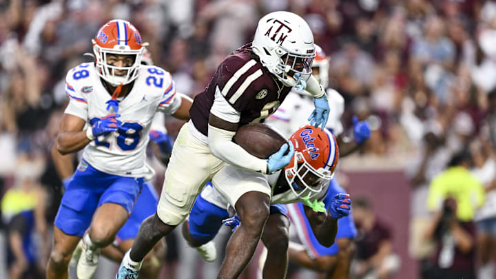 Oct 11, 2025; College Station, Texas, USA; Texas A&M Aggies running back Le'Veon Moss (8) runs the ball in for a touchdown during the second quarter against the Florida Gators at Kyle Field. Mandatory Credit: Maria Lysaker-Imagn Images 