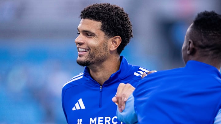 Mar 15, 2025; Charlotte, North Carolina, USA; FC Cincinnati defender Miles Robinson (12) warms up against the Charlotte FC at Bank of America Stadium. Mandatory Credit: Scott Kinser-Imagn Images