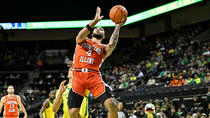 Jan 2, 2025; Eugene, Oregon, USA; Illinois Fighting Illini guard Kylan Boswell (4) drives to the basket against the Oregon Ducks during the second half at Matthew Knight Arena. Mandatory Credit: Craig Strobeck-Imagn Images