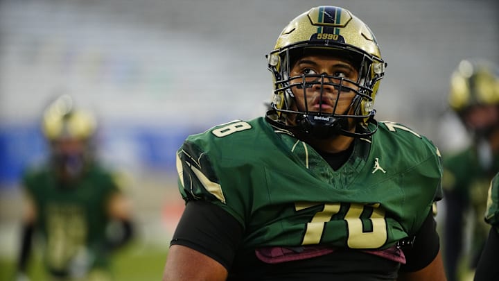 Basha defensive lineman Anitoni Tahi. 