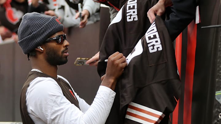 Cleveland Browns quarterback Shedeur Sanders signs autographs for fans before an NFL football game at Huntington Bank Field, Nov. 16, 2025, in Cleveland, Ohio.